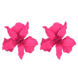 Detailed macro view of large oversized fuchsia floral earrings with a matte textured finish