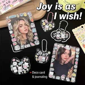 Close-up of DIY decorative stickers and acrylic card holders for K-pop photo journals