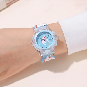 Detailed view of light blue unicorn kids watch with rainbow strap and glowing LED dial