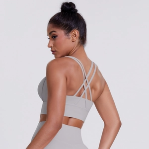 Detailed back view of light gray sports bra featuring multiple criss-cross elastic straps