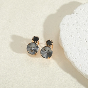 Detail of elegant black and smoky grey multi-faceted crystal dangle earrings