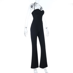 Detail view of black strapless halter jumpsuit featuring flared legs on a mannequin