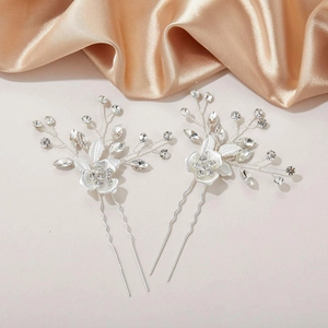Silver bridal hair pins with floral leaf design and sparkling clear crystals for weddings