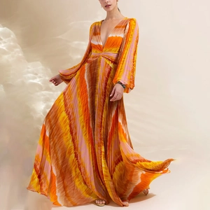 Detail of V-neck long sleeve printed swimsuit with vibrant orange gradient pleats