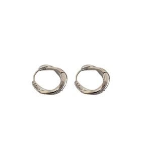 Minimalist silver twist hoop earrings with sparkling zircon inlay on white background