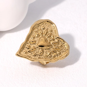 Gold heart ring with hammered texture and lava edges shown from a 45-degree angle