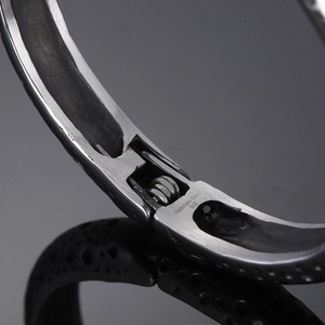 Macro shot of 316L stainless steel bracelet hinge with material engraving
