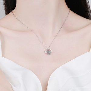 S925 sterling silver moissanite necklace featuring a geometric square pendant on a woman