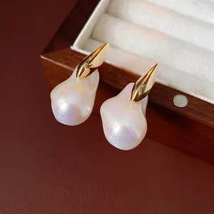 Artistic gold-plated flame earrings with baroque pearls in a luxury wooden gift box