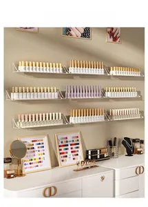 Wall-mounted acrylic nail polish rack with clear shelves and protective front ledge