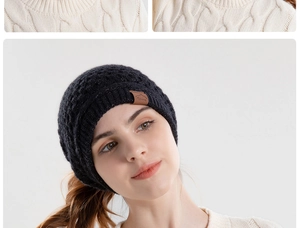 Close-up of black winter knit beanie featuring a brown leather sport patch on the cuff