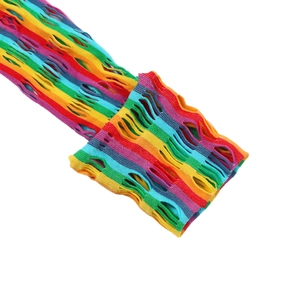 Macro shot of colorful rainbow striped mesh gloves with punk style distressed cutout details