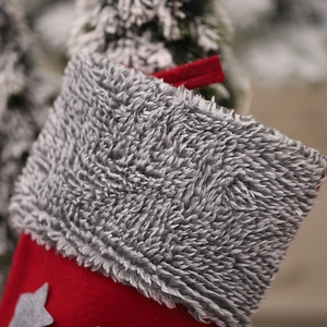 Christmas gnome stocking in red felt with gray plush cuff and star pattern details