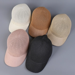 Top view of five breathable knitted baseball caps in cream, khaki, brown, pink, and black