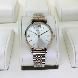 Close-up of GEDI women's watch with two-tone steel band and diamond-set Roman dial