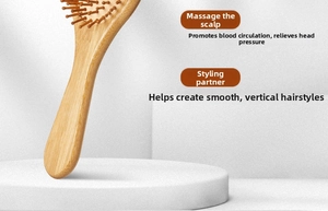 Macro view of natural bamboo massage comb with round tips on a minimalist display