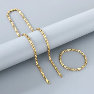 Macro shot of 18k gold plated coffee bean link chain necklace and bracelet set