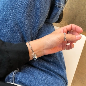 925 sterling silver heart bracelet with OT buckle and star ring worn on casual outfit