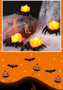 Close-up of a spider-shaped LED candle with warm flickering light and dripping wax detail