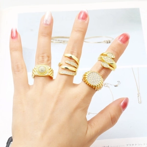 Set of four gold-plated rings with clear cubic zirconia in multiple elegant designs
