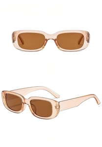 Detail view of vintage rectangle sunglasses featuring champagne frames and brown lenses