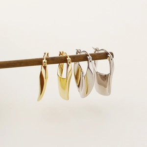 Detail of irregular S925 silver ear cuffs in gold and silver finishes in two sizes