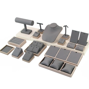 Detailed view of grey jewelry display set with necklace bust and bracelet holder