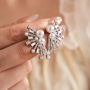 Elegant fan-shaped pearl earrings with sparkling crystal accents for a luxury fashion look