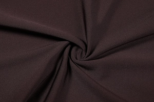 Detailed view of dark brown knit fabric showing soft texture and premium drape quality