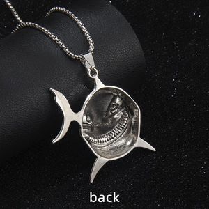 Silver stainless steel shark pendant necklace with a detailed smiling teeth design back