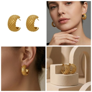 Detail view of gold C-shaped earrings with geometric grid pattern on female model