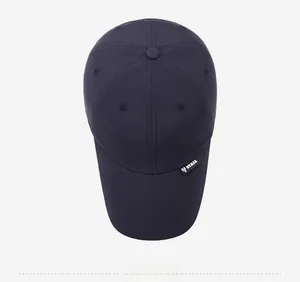 Top-down view of navy blue breathable sports cap with woven NY&JA brand logo tag