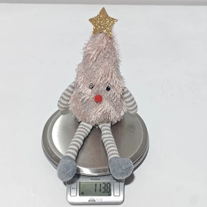 Detailed close-up of a pink plush Christmas tree doll showing soft faux fur and weight details