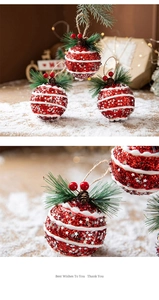Macro detail of red glitter Christmas ball with pine needles and small pine cones