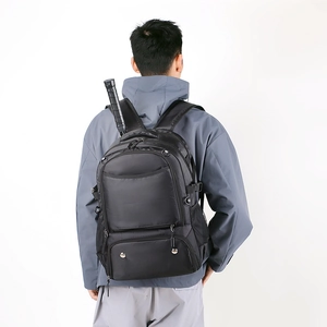 Rear view of a black waterproof sports backpack showing racket storage and mesh pockets