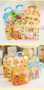 Close-up of cute cartoon cookie bags with handles and secure zip lock closure