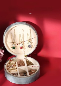 Macro detail of jewelry box interior with necklace hooks and ring slots