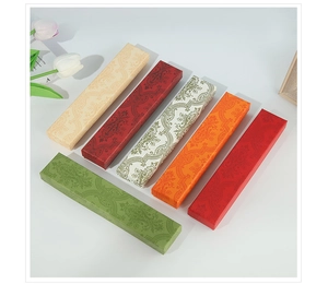 Detailed view of colorful rectangular brocade jewelry boxes with elegant patterns