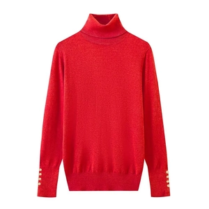 Detailed view of red slim fit turtleneck sweater featuring gold buttons on sleeve cuffs