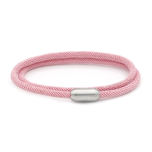 Detail of pink double-layered woven cord bracelet with silver magnetic cylinder clasp