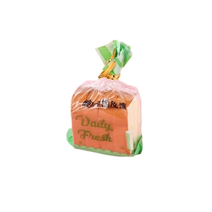 Creative toast bread erasers in a transparent bag with green base and gold tie