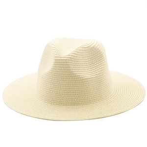Detailed close-up of cream straw fedora hat showing fine spiral woven texture and crown
