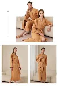 Couples waffle texture bathrobes in orange with white trim details in home setting