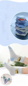 Detail of breathable combed cotton baby socks featuring colorful cartoon car patterns