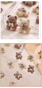 Detail of plush brown and beige cartoon bear charms with bows for 3D nail art decor