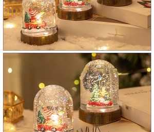 Detail of Christmas snow globe with Santa in sleigh on a rustic wooden base