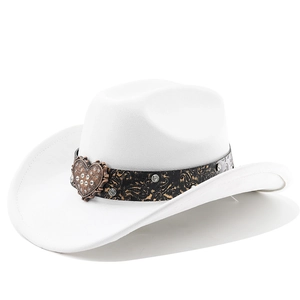 Close-up of a white western cowboy hat featuring an ornate band and a crystal heart buckle