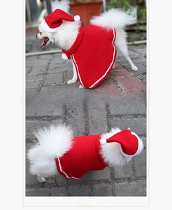 Detail view of red pet Christmas cloak and hat set with plush trim from side and top angles