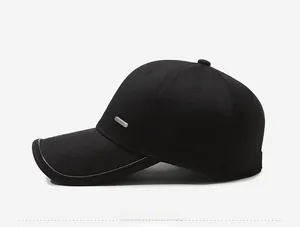 Side view of black cotton baseball cap with silver metal rectangle branding detail