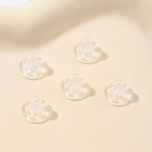 Macro detail of transparent silicone butterfly earring backs for DIY jewelry making